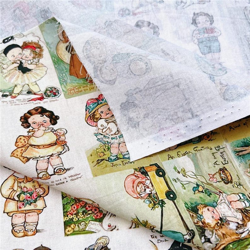 May include: Off-white fabric with a repeating pattern of vintage children's illustrations. The illustrations feature children in various poses, some holding flowers or toys. The fabric has a slightly textured appearance and a folded section revealing the underside.