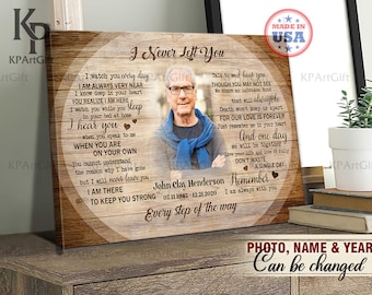 May include: A wooden framed canvas print with the text "I Never Left You" and a photo of an older man. The print includes a poem and the text "Photo, Name & Year Can be changed". The print is on a wooden surface.