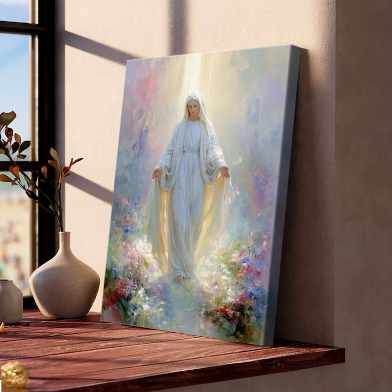 May include: A canvas print of a religious figure in a white gown with outstretched arms, surrounded by soft light and colorful flowers. The artwork has a serene and ethereal quality, with a focus on the central figure.