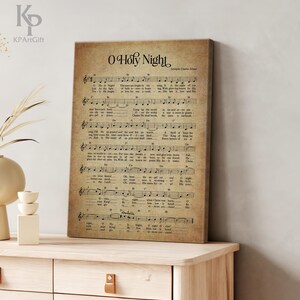 May include: Vintage style print of the song "O Holy Night" with sheet music and lyrics. The print is on a beige background with brown text.