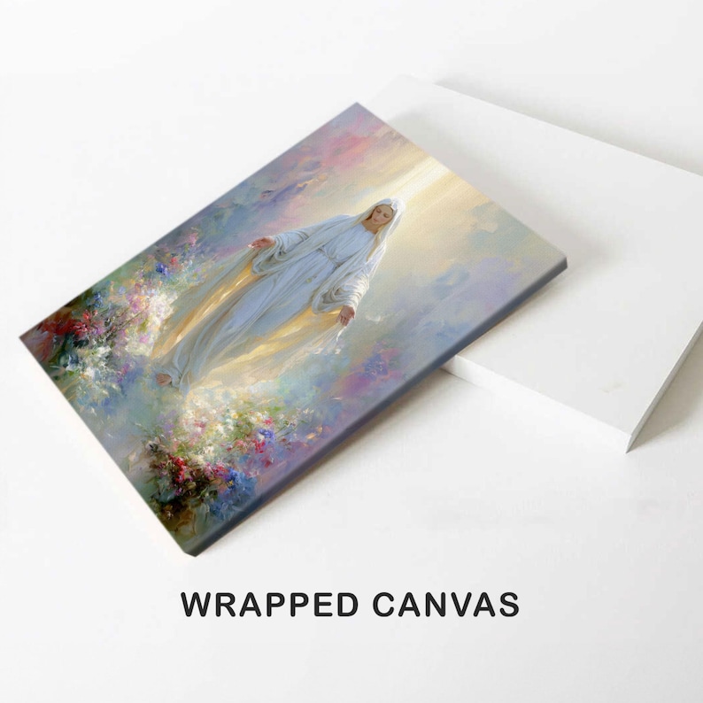 May include: Wrapped canvas art print featuring a celestial figure in flowing white robes, surrounded by soft light and pastel colors. The artwork depicts a serene scene with floral accents, evoking a sense of peace and spirituality.