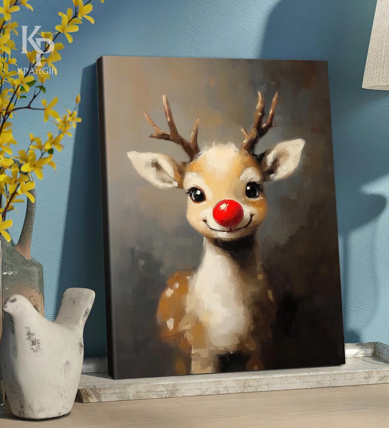 May include: A painting of a cartoon reindeer with a red nose. The reindeer is smiling and has brown antlers. The background is a dark brown color.
