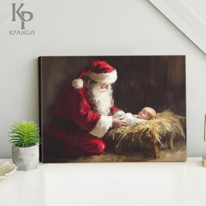 May include: A painting of Santa Claus kneeling beside a baby in a manger. Santa is wearing a red suit with white trim and a white beard. The baby is wearing a white cloth and is lying on a bed of straw.