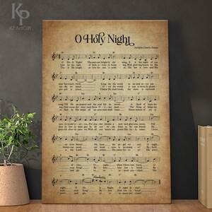 May include: A vintage-style print of the Christmas carol "O Holy Night" with sheet music and lyrics. The print features a brown background with faded text and musical notes.