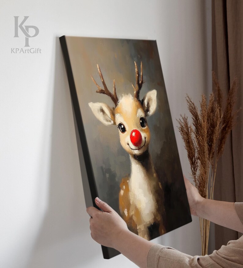 May include: A painting of a cute reindeer with a red nose. The reindeer is looking at the viewer with a friendly expression. The background is a soft brown color.