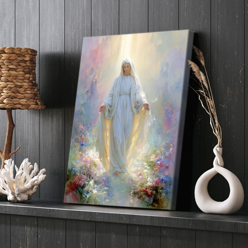 May include: A canvas print depicts a serene figure in a flowing white gown, arms outstretched, amidst a soft, colorful background of flowers and light. The artwork evokes a sense of peace and spirituality, suitable for home decor.