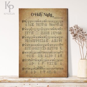May include: A vintage-style sheet music print of the Christmas carol "O Holy Night". The sheet music is printed on aged paper with a brown background and features the lyrics and musical notation for the song.