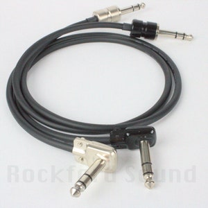 May include: Two black guitar cables with right-angle plugs on one end and straight plugs on the other end.