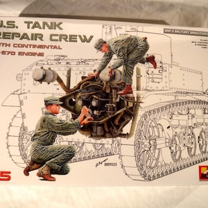 May include: A plastic model kit box for a U.S. Tank Repair Crew with Continental W-670 engine, scale 1:35. The box features an illustration of two figures in green uniforms working on a tank engine, with technical line art of a tank in the background.