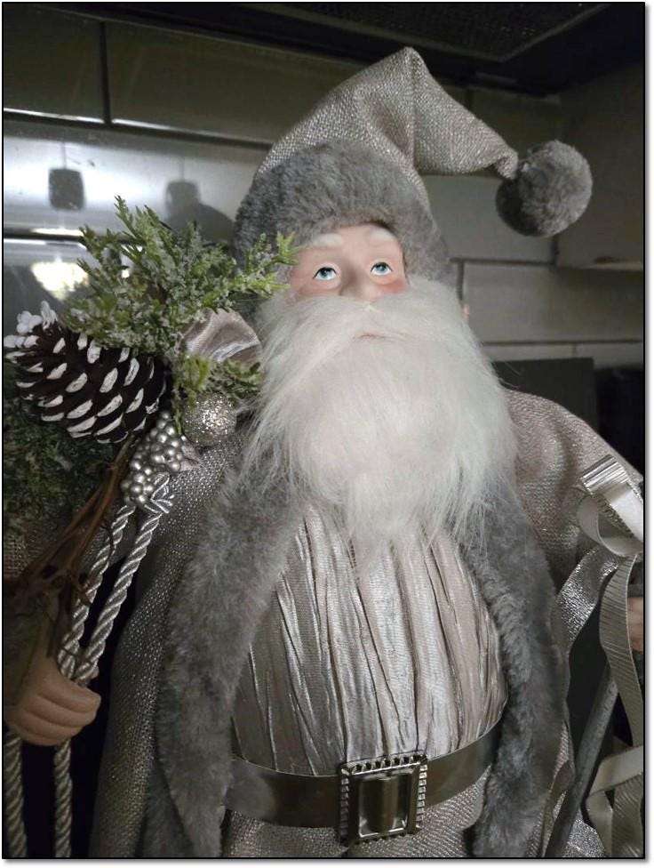 Vintage 19” Tall Silver Santa in a Silver Metallic Robe with Pine-Filled Gift Sack and a Silver Staff. 50 Dollars. OPDC-S007