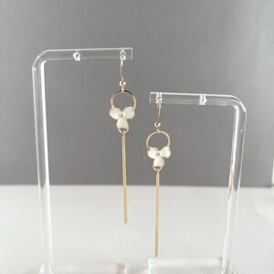 Gold Flower Dangle Earrings: Floral Statement Jewelry