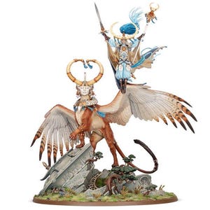 May include: A miniature figurine of a female elf riding a griffin. The elf is wearing a blue and gold outfit and holding a staff. The griffin is brown and white with gold accents. The figurine is set on a base with a stone structure and greenery.