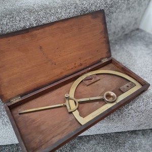 A 19th century semi-circular brass Protractor