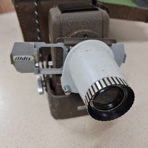 Aldis Slide Projector Vintage with Large Box of slides.