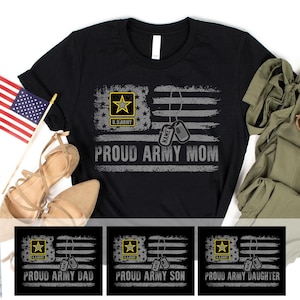 May include: Black t-shirt with a distressed American flag design. The flag incorporates a U.S. Army emblem and dog tags. The words "PROUD ARMY MOM" are printed across the flag. Additional designs read "PROUD ARMY DAD", "PROUD ARMY SON", and "PROUD ARMY DAUGHTER".