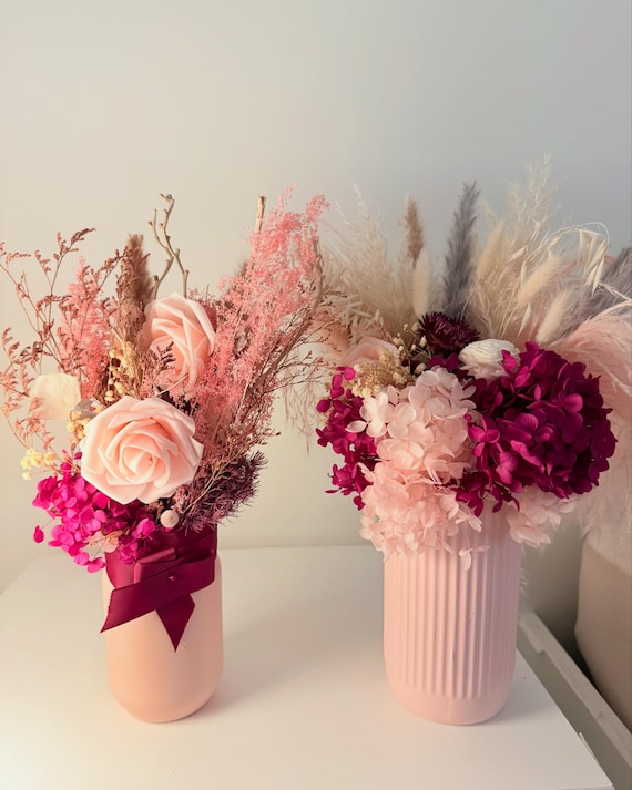 Pink vase with dried flowers