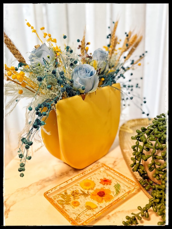 Preserved flowers in Yellow vase