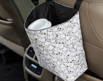 Papelera para coche con reposacabezas ajustable, con estampado de papel higiénico y forro de lona impermeable negra, accesorios personalizados para coche limpio.