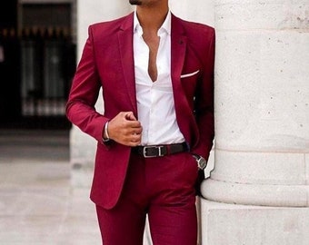 maroon coat and white pants