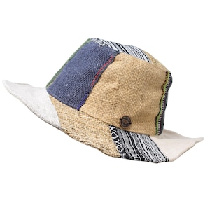 May include: A multi-colored patchwork hat made from natural fibers. The hat has a wide brim and is made of a variety of fabrics, including burlap, cotton, and linen. The hat is a unique and stylish accessory that is perfect for any occasion.
