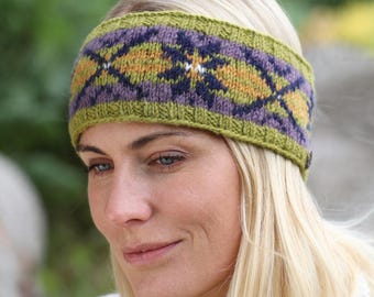 May include: A knitted headband with a geometric pattern. The headband features a green base with diamond shapes in purple, yellow, and navy blue. The accessory is designed to keep the ears warm and add a touch of style.