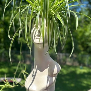 pearl white planter looking like a lady’s bust, plastic with transcending pothos and spider planter eclectic vase home Upcycled planter