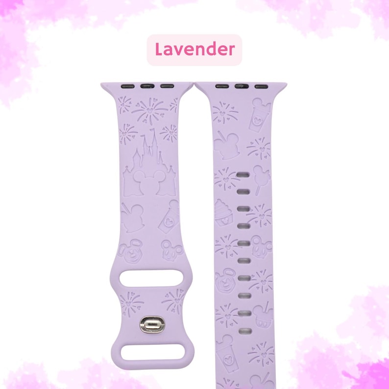 May include: A lavender silicone Apple Watch band with a Disney theme. The band features a pattern of fireworks, Mickey Mouse, Cinderella's castle, and other Disney icons.