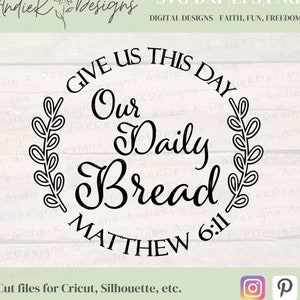 May include: Black and white design for a round sign with a wreath on either side. The sign reads "Give us this day our daily bread Matthew 6:11".