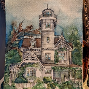 May include: Watercolor painting of a white house with a tower, surrounded by green foliage. The house has multiple windows and a white picket fence. The painting is signed "PRACTICAL MAGIC" in the bottom left corner.