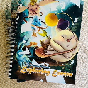 May include: A spiral bound planner with a colorful illustration of a fantasy creature and the text "A Final Fantasy XIV Planner: Exploring Eorzea".