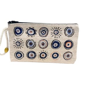 Cartera auténtica con estampado de mal de ojo y tapiz