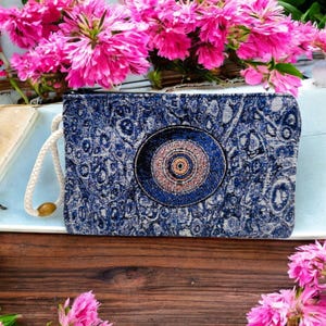 Cartera auténtica con estampado de mal de ojo y tapiz