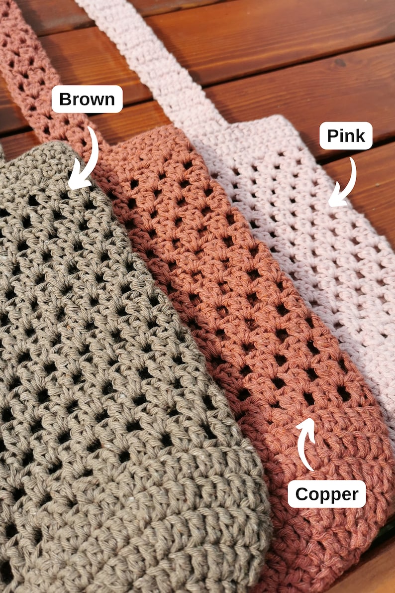 May include: Three crocheted bags in brown, copper, and pink. The bags are made with a square stitch pattern and have a woven strap.