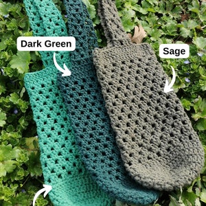 May include: Three crocheted bags in different shades of green. The bags are labeled "Dark Green", "Green", and "Sage".