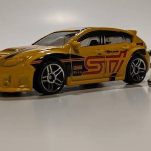 Stinkeye Subaru Impreza WRX STI Hatchback Llavero Hot Wheels/Matchbox Escala 1/64