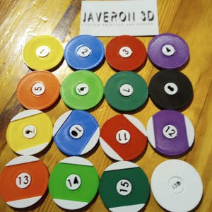 May include: A set of 15 colorful round counters with white numbers from 1 to 15 and a white counter with the number 30. The counters are arranged in rows on a wooden surface. JAVERON 3D CUSTOM PRINTING AND DESIGN is printed on a white card.