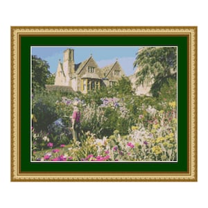 May include: A framed painting of a stone house with a lush green garden in the foreground. The house has a white door and windows, and the garden is filled with colorful flowers.