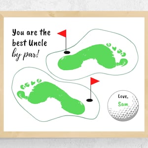 May include: A white board with a green and white golf course design. The text "You are the best Uncle by par!" is written in black. A golf ball with the text "Love, Sam" is in the bottom right corner.