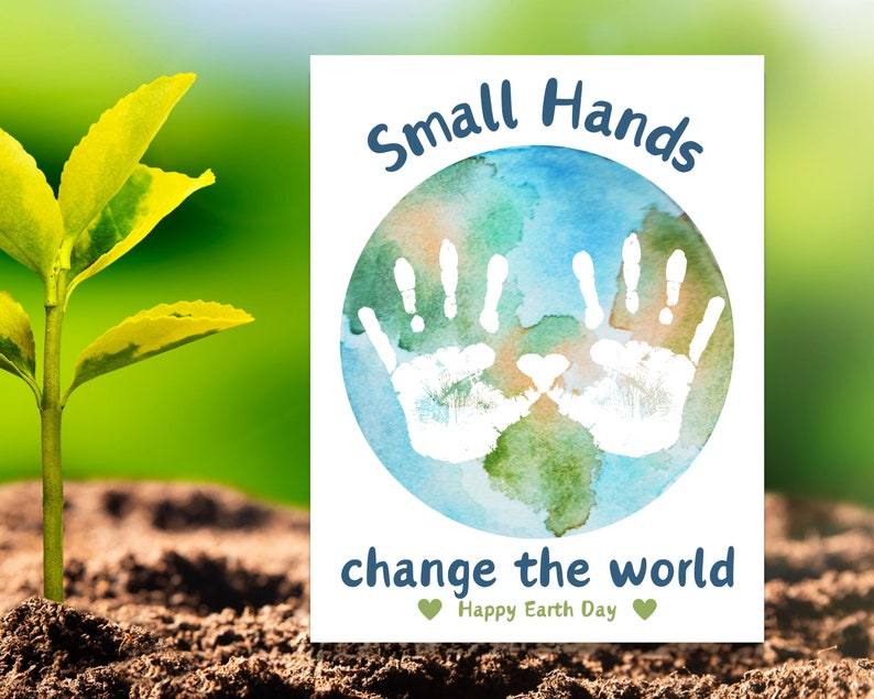 May include: A white card with a blue watercolor globe with two white handprints on it. The text "Small Hands change the world" is below the globe. The text "Happy Earth Day" is below the text.