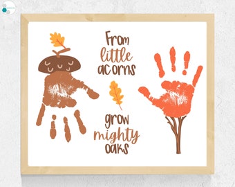 May include: A brown handprint with an acorn on top and the text "From little acorns grow mighty oaks" and a red handprint with a brown tree trunk below.