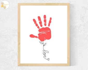 May include: A red handprint in the shape of a flower with a stem and leaves. The word "love" is written in cursive below the flower.
