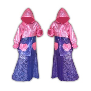 May include: Two pink raincoats with attached hoods and heart-shaped pockets. The upper portion of the raincoats is pink, while the lower portion is blue with a floral pattern. The raincoats are designed to be worn over clothing.