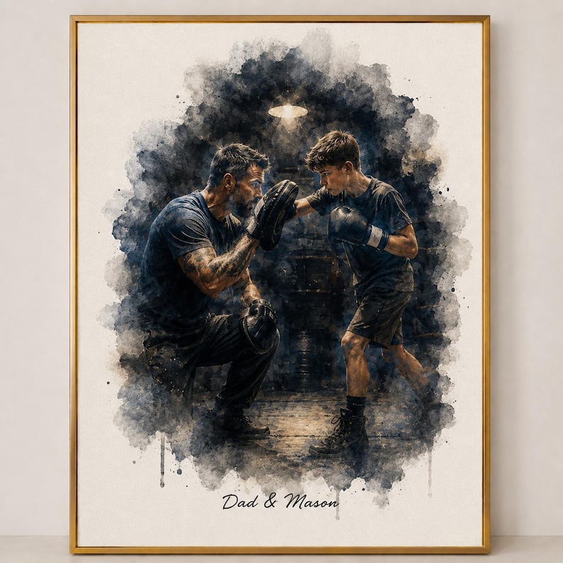 May include: Watercolor-style print in a gold frame depicts a boxing scene. A man and a boy are engaged in boxing, with the man holding pads. The text "Dad & Mason" is at the bottom. The artwork has a dark, moody aesthetic.