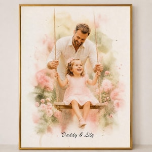 May include: A framed watercolor print depicts a father pushing his daughter on a swing. The girl wears a pink dress and smiles. The background features pink flowers and the text "Daddy & Lily". The frame is gold.