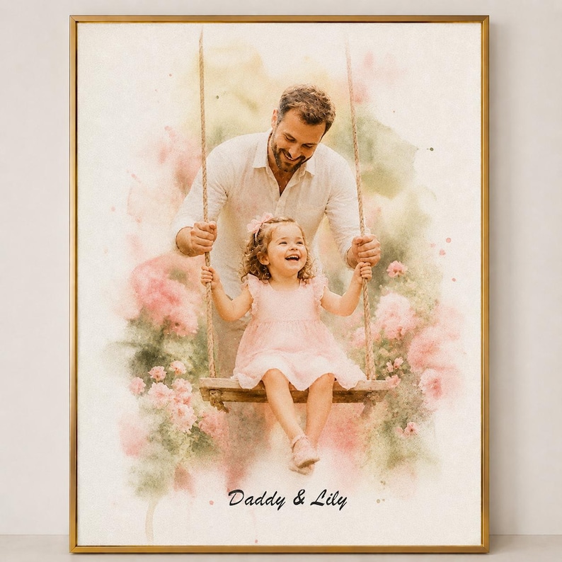 May include: A framed watercolor print depicts a father pushing his daughter on a swing. The girl wears a pink dress and smiles. The background features pink flowers and the text "Daddy & Lily". The frame is gold.