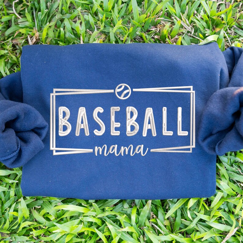 May include: Navy blue sweatshirt with a white embroidered baseball logo and the text "baseball mama".