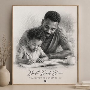 May include: A framed black and white sketch print featuring a father and child. The child is writing in a book, while the father looks on. The text "Best Dad Ever" and "Thank you for everything" are below the image.