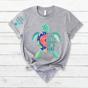 May include: Gray t-shirt with a colorful turtle graphic and the text "In a world full of grandmas be a Nana".