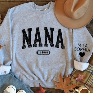 Personalized Nana Est Varsity Sweatshirt, Custom Nana Sweatshirt and Grandkids Names On Sleeve, Custom Nana Est 2023 kids on sleeve