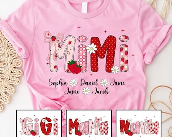 May include: Pink t-shirt featuring the word "MIMI" in a strawberry-themed design, with names Sophia, Daniel, Jame, and Jacob below. Additional designs include "GiGi", "Mama", and "Nana" shirts.